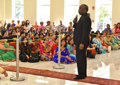 chief guest addressing the devotees of maa durga sai baba temple in orlando